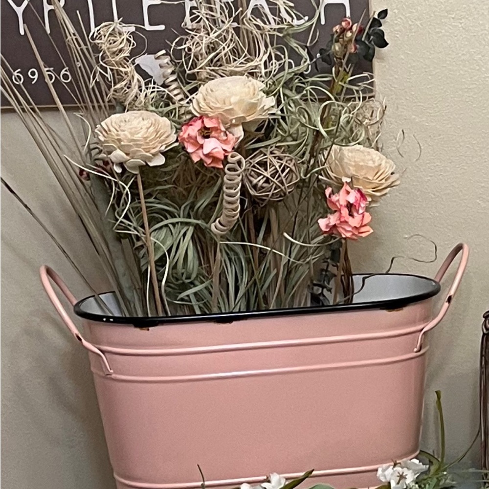 Pink bucket with chicken design on one side